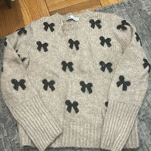 Zara sweater with rhinestoned bow detailing. Size medium.